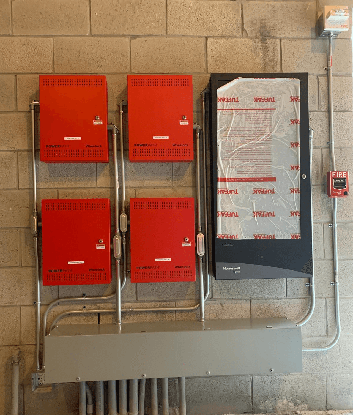 Notifier PowerPath fire alarm power supplies and Honeywell control cabinet