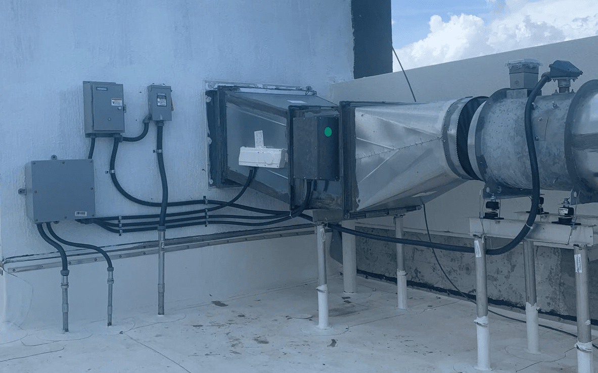 Rooftop HVAC equipment with electrical disconnects and conduit installation
